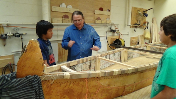 Wayne explaining to ENGAGE boys how to sew side panels