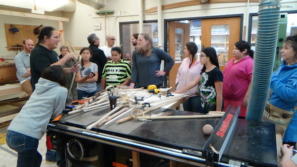 Wayne explains process of making LaCrosse sticks to ENGAGE girls and teachers