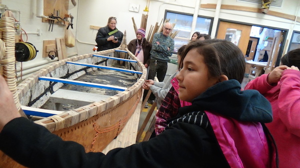 Engage girls arrive to inspect canoe in shop