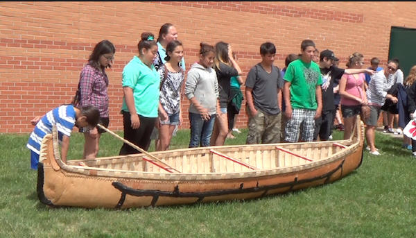 ENVISION students and Wayne with canoe