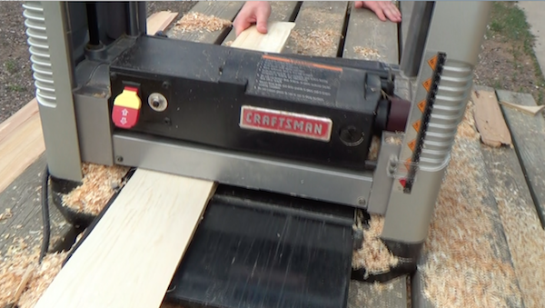 Pieces of cedar are run through a planer