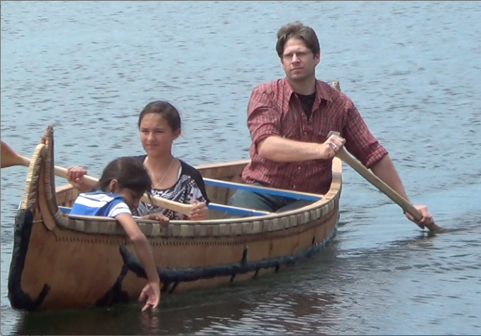 Tim Frandy taking Ojibwe ENGAGE students for a ride in the canoe, June 2014 Lac du Flambeau