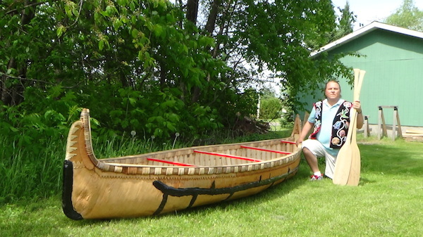 Wayne posing with finished canoe, Lac du Flambeau, June, 2014