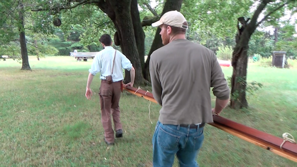 carrying the soaked gunwale pieces back to Wayne's house