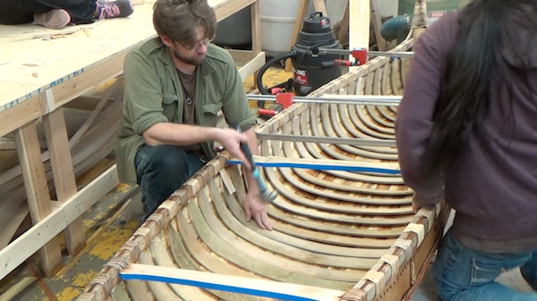 final rib being added at center of canoe