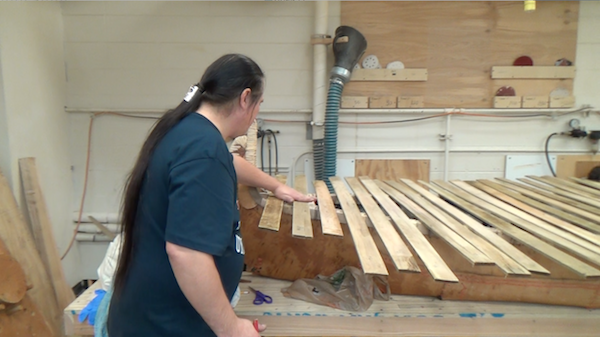 the ribs for the canoe are placed on top of canoe to make sure that there are enough