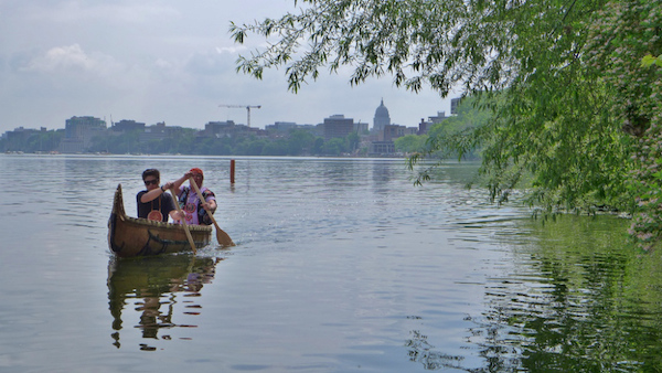 Wayne and son paddling canoe, Lake Mendota