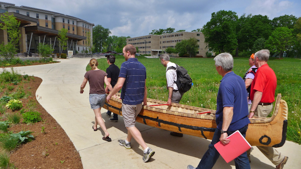 Canoe being carried to Dejope