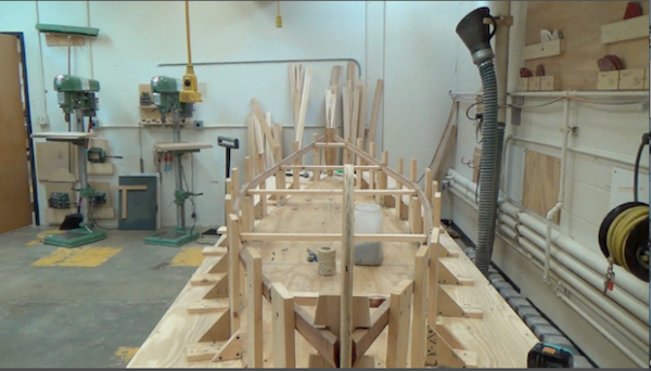 gunwales in place in woodshop, drying