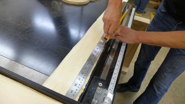 sheathing piece being cut on a table saw