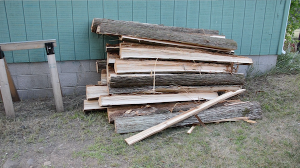 stack of split cedar logs at Wayne's house