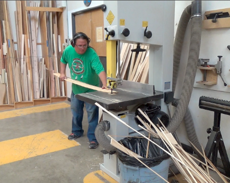 Wayne using ban saw to cut ribs to shape